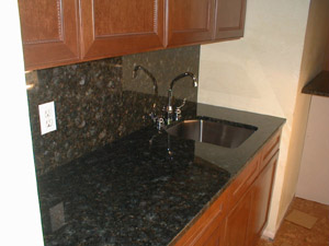Granite backsplach and counter add a gorgeous touch.
