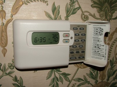 A programmable thermostat, when used correctly, can save impressive amounts of money on your home heating bills.  PHOTO CREDIT: Tim Carter