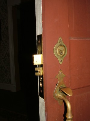 The latch of the deadbolt lock needs to line up squarely with the metal keeper plate in the door jamb.  PHOTO CREDIT: Tim Carter
