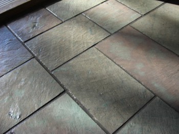 Slate is an attractive and durable flooring material. There are many other uses for it as well around the house. PHOTO CREDIT: Tim Carter