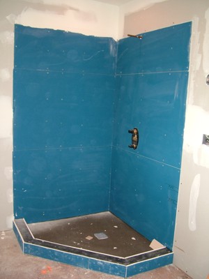 This coated backer board is easy to install and works well on walls and floors. PHOTO CREDIT:  Tim Carter
