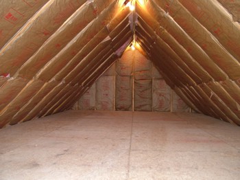 This attic storage area can be insulated in just a few hours by a serious do-it-yourselfer. PHOTO CREDIT:  Tim Carter