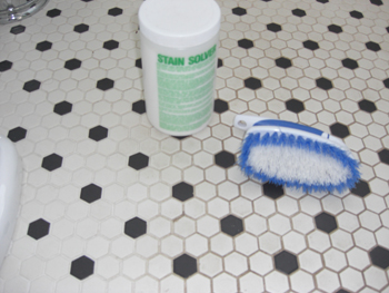 Powdered oxygen bleach, a scrub brush and some water are all you need to make tile and grout look like new. PHOTO CREDIT:  Tim Carter