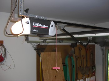 This garage door opener can last for many years if most of the lifting of the door is performed by the springs attached to the door. PHOTO CREDIT:  Tim Carter