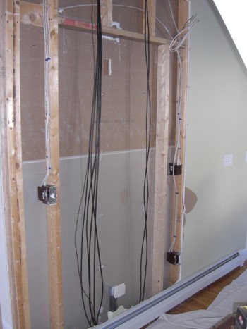 Surprise, surprise! When you go to install a pocket door in an existing home, you’re often met with challenges like these cable TV wires. PHOTO CREDIT:  Tim Carter