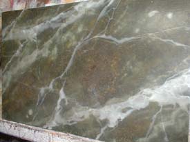 Faux finishing can make a surface look like real stone.