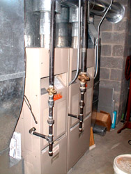 Here are my two furnaces. They were installed in December, 1986. As of June, 2004, they were still working perfectly. But they are just about at the end of their useful lives. Within 12 months, I will probably replace them with the highest efficiency units I can get.