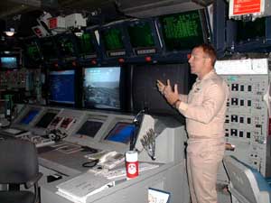 The Combat Direction Center bristles with technology to defend the ship. PHOTO BY: Tim Carter