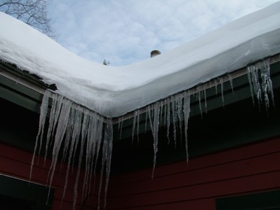 The ice at the edge of this roof is nearly 6-inches thick. Just in this small section, there is hundreds of pounds of weight. PHOTO CREDIT: Tim Carter