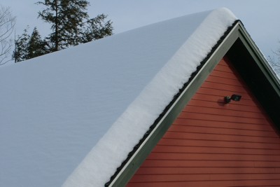 The snow is deep across the entire roof. As winter progresses, the snow compacts and gets heavier. PHOTO CREDIT: Tim Carter